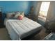Cozy bedroom with a double bed and plenty of natural light at 8431 Edgewater Place Blvd, Tampa, FL 33615