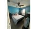 Spacious bedroom with a queen bed and ceiling fan at 8431 Edgewater Place Blvd, Tampa, FL 33615