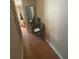 Home hallway with wood flooring and a small workspace at 8431 Edgewater Place Blvd, Tampa, FL 33615