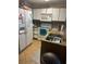 Galley style kitchen with granite countertops and appliances at 8431 Edgewater Place Blvd, Tampa, FL 33615