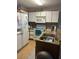 Galley style kitchen with granite countertops and appliances at 8431 Edgewater Place Blvd, Tampa, FL 33615