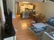 Living room features hardwood floors, a dining area, and comfy seating at 8431 Edgewater Place Blvd, Tampa, FL 33615
