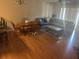 Open concept living and dining area with hardwood floors at 8431 Edgewater Place Blvd, Tampa, FL 33615