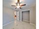 Bright bedroom featuring a ceiling fan and ample closet space at 9328 Temple Ave, Seminole, FL 33772