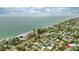Aerial view of beachfront homes and neighborhood at 105 3Rd St, Belleair Beach, FL 33786