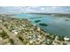 Aerial view of waterfront homes and neighborhood at 105 3Rd St, Belleair Beach, FL 33786