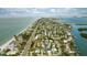 Aerial view of beachfront homes and neighborhood at 105 3Rd St, Belleair Beach, FL 33786