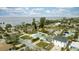 Aerial view of a coastal neighborhood showcasing houses near the ocean at 105 3Rd St, Belleair Beach, FL 33786