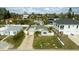 Single story home with paver driveway and large yard at 105 3Rd St, Belleair Beach, FL 33786