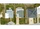 Aerial view of three homes with similar architecture at 105 3Rd St, Belleair Beach, FL 33786