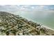 Aerial view of beachfront homes and ocean at 105 3Rd St, Belleair Beach, FL 33786