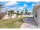 Spacious backyard with patio and well maintained lawn at 105 3Rd St, Belleair Beach, FL 33786