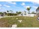 Charming bungalow with a large grassy yard and paver driveway at 105 3Rd St, Belleair Beach, FL 33786