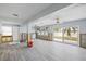 Large living room with sliding doors leading to the backyard at 105 3Rd St, Belleair Beach, FL 33786