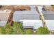 Aerial view of single story home with gray roof at 10800 Queens Rd, Port Richey, FL 34668