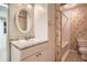 Bathroom with granite countertop and oval mirror at 1207 Eastloch Ct, Sun City Center, FL 33573
