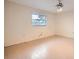 Simple bedroom with light flooring and a window at 1207 Eastloch Ct, Sun City Center, FL 33573