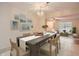 Dining room with table and chairs, open to living room at 1207 Eastloch Ct, Sun City Center, FL 33573