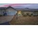 Front view of a single story home with stone exterior and attached garage at 1207 Eastloch Ct, Sun City Center, FL 33573