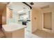 Kitchen with white cabinets, tile floors and peninsula counter at 1207 Eastloch Ct, Sun City Center, FL 33573