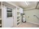 Laundry room with shelving and exterior access at 1207 Eastloch Ct, Sun City Center, FL 33573