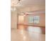 Living room with tile and wood flooring, and access to patio at 1207 Eastloch Ct, Sun City Center, FL 33573