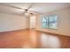 Living room with wood floors and access to entryway at 1207 Eastloch Ct, Sun City Center, FL 33573