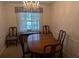 Formal dining room with wood table and window at 1410 Gertrude Dr, Brandon, FL 33511