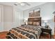 Bedroom with double door closet and ceiling fan at 15005 Lake Emerald Blvd, Tampa, FL 33618