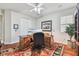 Bright home office with wood desk and ample natural light at 15005 Lake Emerald Blvd, Tampa, FL 33618