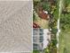 Aerial view of the house and backyard, highlighting the screened patio and landscaping at 1531 Riverdale Dr, Oldsmar, FL 34677