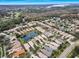 Aerial shot of a community with houses centered around a pond at 1531 Riverdale Dr, Oldsmar, FL 34677