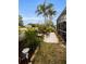 Relaxing backyard space with patio seating, mature plants, and a tranquil atmosphere at 1531 Riverdale Dr, Oldsmar, FL 34677