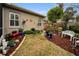 Well-maintained backyard with decorative plants and seating at 1531 Riverdale Dr, Oldsmar, FL 34677