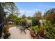 Charming backyard oasis featuring a patio and lush greenery at 1531 Riverdale Dr, Oldsmar, FL 34677