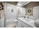 Clean bathroom with white cabinets and a large bathtub at 1531 Riverdale Dr, Oldsmar, FL 34677