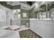 Elegant bathroom with double vanity and walk-in shower at 1531 Riverdale Dr, Oldsmar, FL 34677