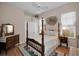 Cozy bedroom with hardwood floors and a wooden four-poster bed at 1531 Riverdale Dr, Oldsmar, FL 34677