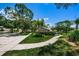 Landscaped community path with lush green grass at 1531 Riverdale Dr, Oldsmar, FL 34677