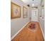 Bright and airy entryway with hardwood floors and elegant wall art at 1531 Riverdale Dr, Oldsmar, FL 34677