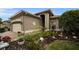 One story house with a two car garage and nicely landscaped front yard at 1531 Riverdale Dr, Oldsmar, FL 34677