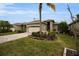 One-story house with a two-car garage and a nicely landscaped front yard at 1531 Riverdale Dr, Oldsmar, FL 34677