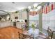 Kitchen features a breakfast nook, island, stainless steel appliances, and hardwood floors at 1531 Riverdale Dr, Oldsmar, FL 34677