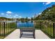 Serene lake view with a bench for relaxation at 1531 Riverdale Dr, Oldsmar, FL 34677