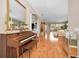 Spacious living room showcasing a piano and hardwood floors at 1531 Riverdale Dr, Oldsmar, FL 34677