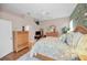Main bedroom with wood furniture and a large window at 1531 Riverdale Dr, Oldsmar, FL 34677