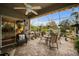 Bright, screened patio boasts comfy seating and garden views at 1531 Riverdale Dr, Oldsmar, FL 34677