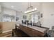 Bright dining room features a spacious wooden table with a modern chandelier at 1551 Daylily Dr, Trinity, FL 34655