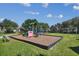 Two playsets, swings, and wood-chip surface at 1551 Daylily Dr, Trinity, FL 34655