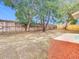 Backyard with patio, fenced yard, and trees at 1612 Fox Run Dr, Tarpon Springs, FL 34689